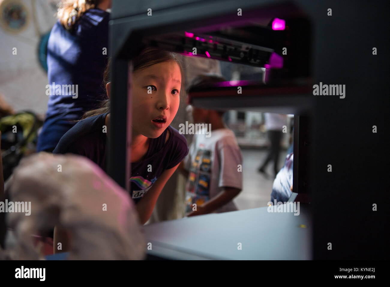 A visitor watches as a rocket is printed by a Makerbot 3D printer at a ...