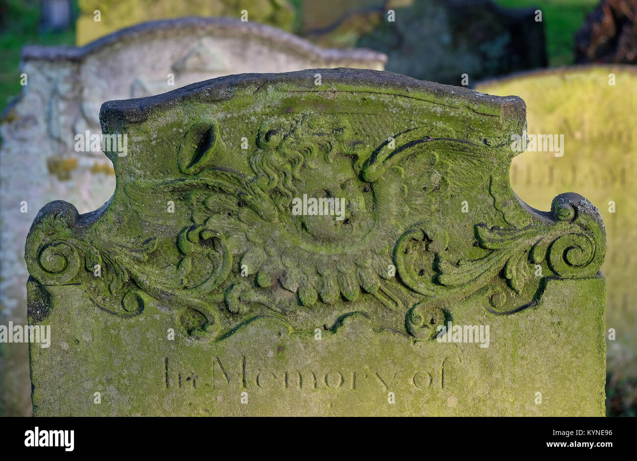 carved-stone-grave-in-english-churchyard-norfolk-england-stock-photo