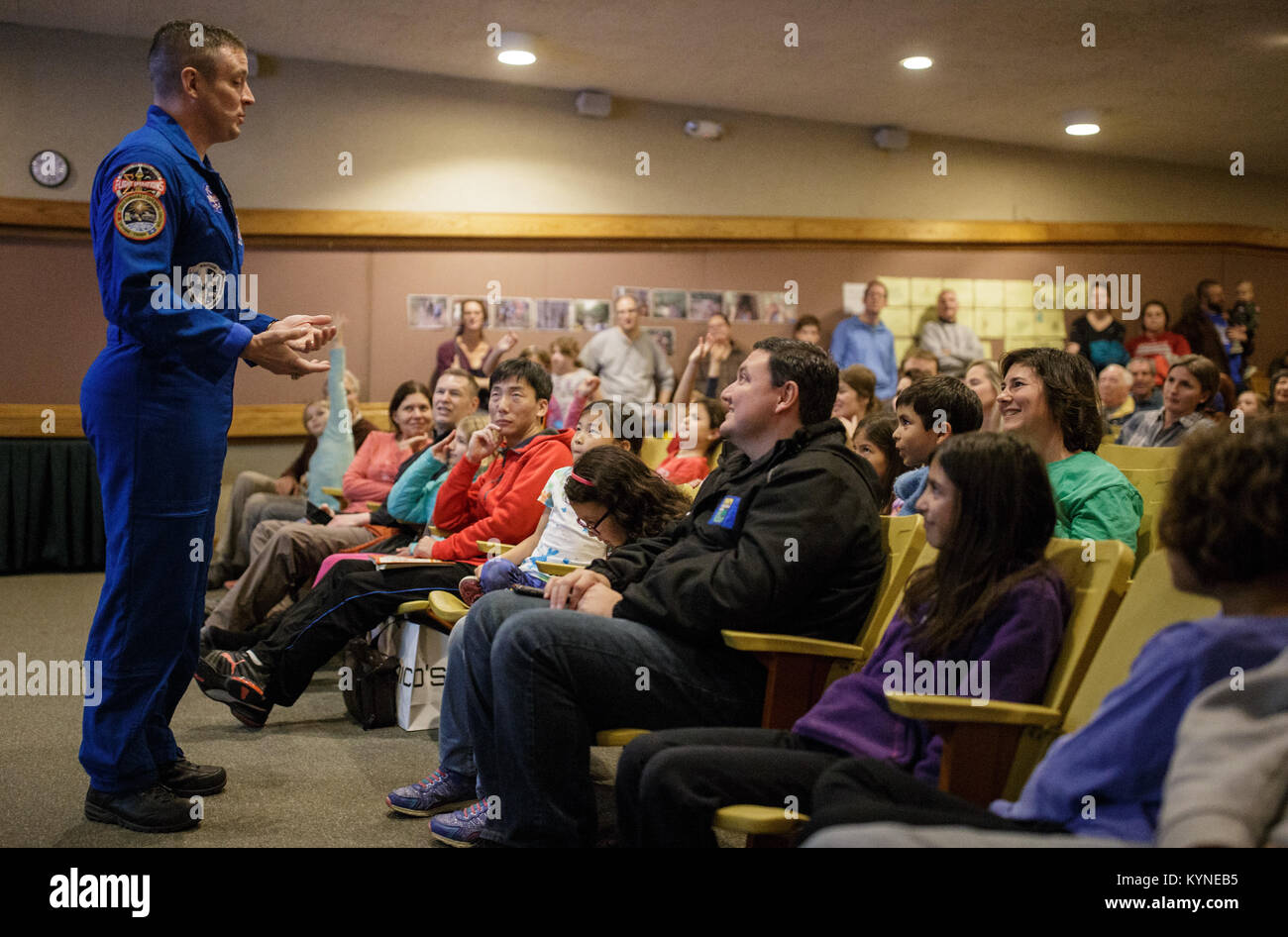 NASA astronaut Jack Fischer answers a question from the audience, Saturday, Nov. 4, 2017 at the Rock Creek Park Nature Center and Planetarium in Washington, DC. During his 136 day mission aboard the ISS, Fischer conducted two spacewalks and hundreds of scientific experiments.  Photo Credit: (NASA/Joel Kowsky) Stock Photo