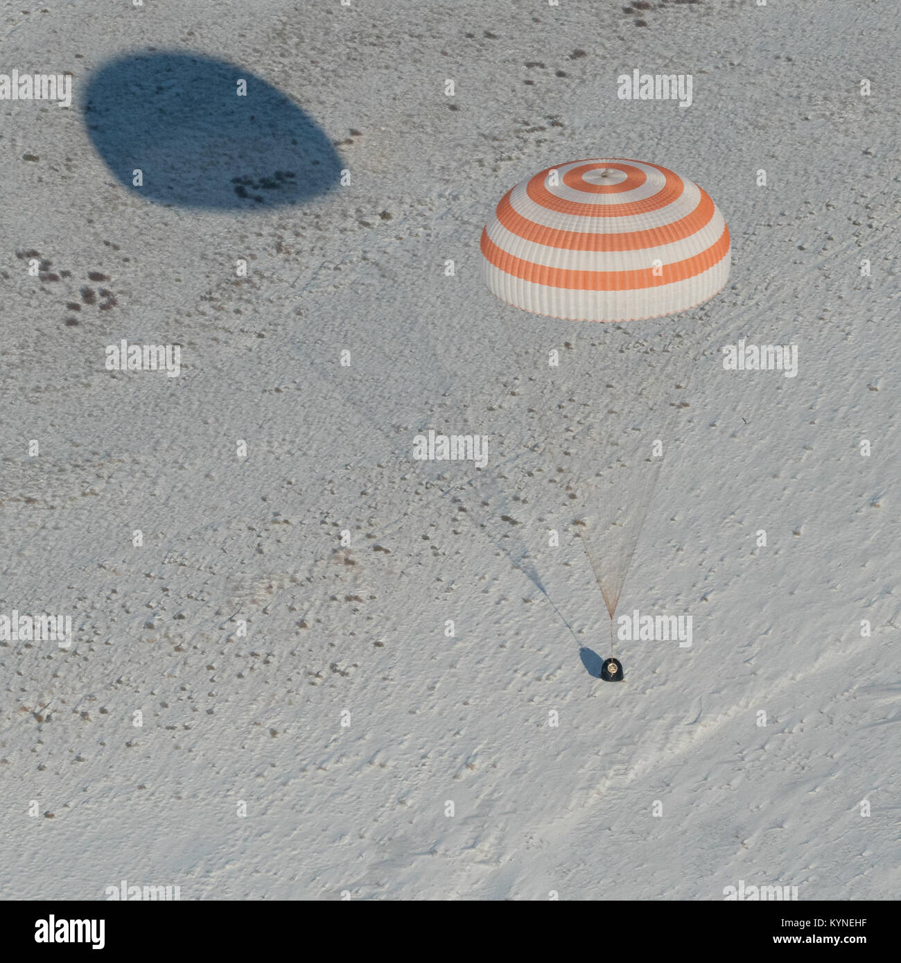 The Soyuz MS-05 spacecraft is seen as it lands with Expedition 53 Commander Randy Bresnik of NASA and Flight Engineers Paolo Nespoli of ESA (European Space Agency) and Sergey Ryazanskiy of the Russian space agency Roscosmos near the town of Zhezkazgan, Kazakhstan on Thursday, Dec. 14, 2017. Bresnik, Nespoli and Ryazanskiy are returning after 139 days in space where they served as members of the Expedition 52 and 53 crews onboard the International Space Station. Photo Credit: (NASA/Bill Ingalls) Stock Photo