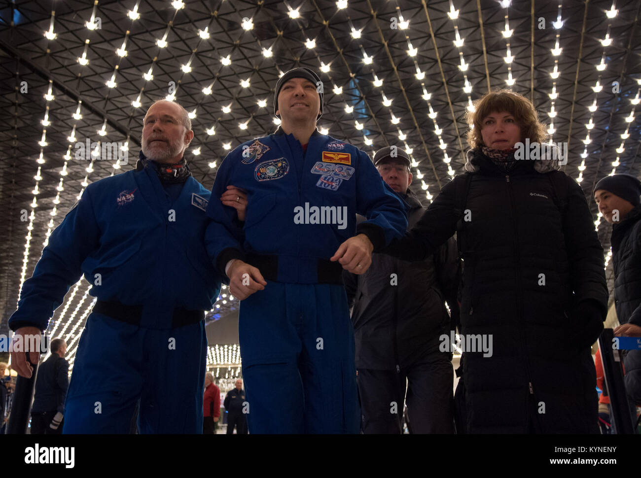 NASA astronaut Randy Bresnik, center, arrives at the Karaganda Airport in Kazakhstan airport after he, Roscosmos cosmonaut Sergey Ryazanskiy and, ESA (European Space Agency) astronaut Paolo Nespoli landed in their Soyuz MS-05 spacecraft in a remote area near the town of Zhezkazgan, Kazakhstan on Thursday, Dec. 14, 2017. Bresnik, Nespoli and Ryazanskiy are returning after 139 days in space where they served as members of the Expedition 52 and 53 crews onboard the International Space Station. Photo Credit: (NASA/Bill Ingalls) Stock Photo
