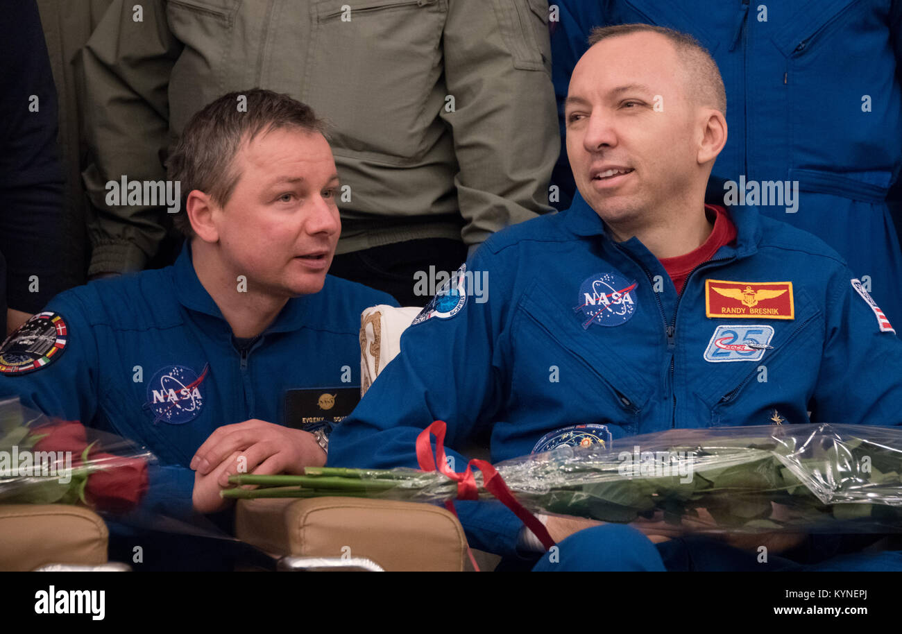 Expedition 53 Commander Randy Bresnik of NASA, right, listens as NASA Interpreter Evgeny Sokol talks during a Karaganda Airport welcome ceremony in Kazakhstan on Thursday, Dec. 14, 2017. 2017.  Bresnik, ESA (European Space Agency) astronaut Paolo Nespoli, and Roscosmos cosmonaut Sergey Ryazanskiy are returning after 139 days in space where they served as members of the Expedition 52 and 53 crews onboard the International Space Station. Photo Credit: (NASA/Bill Ingalls) Stock Photo