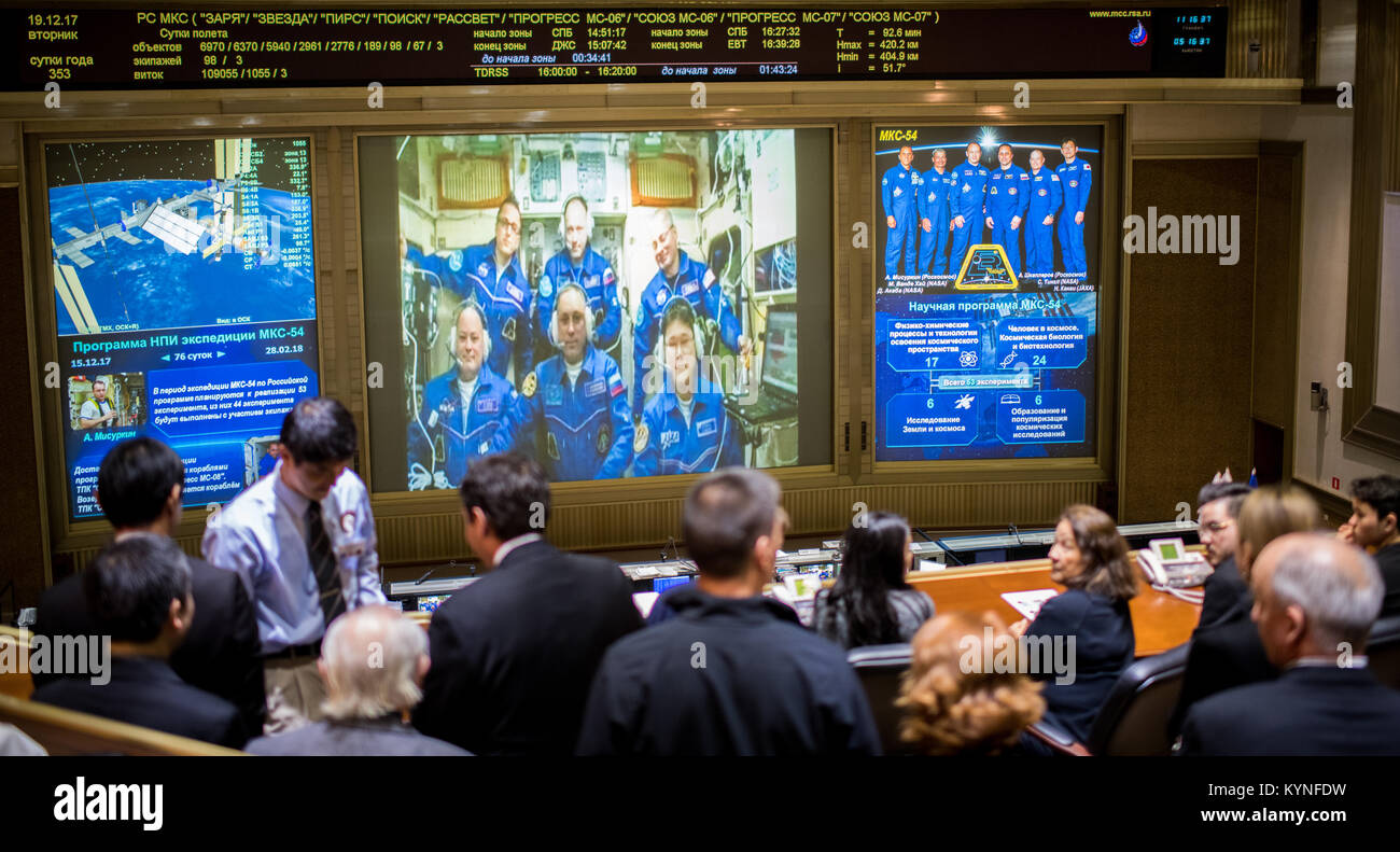 Expedition 54 flight engineers Scott Tingle of NASA, bottom left, Anton Shkaplerov of Roscosmos, bottom center, and Norishige Kanai of the Japan Aerospace Exploration Agency (JAXA) bottom right, are seen with flight engineer Joe Acaba of NASA, top left, Commander Alexander Misurkin, top center, and flight engineer Mark Vande Hei of NASA, top right, on a video monitor as they  U.S. Ambassador to Russia Jon Huntsman Jr. at the Moscow Mission Control Center in Korolev, Russia a few hours after the Soyuz MS-07 docked to the International Space Station on Tuesday, Dec. 19, 2017.  Photo Credit: (NAS Stock Photo