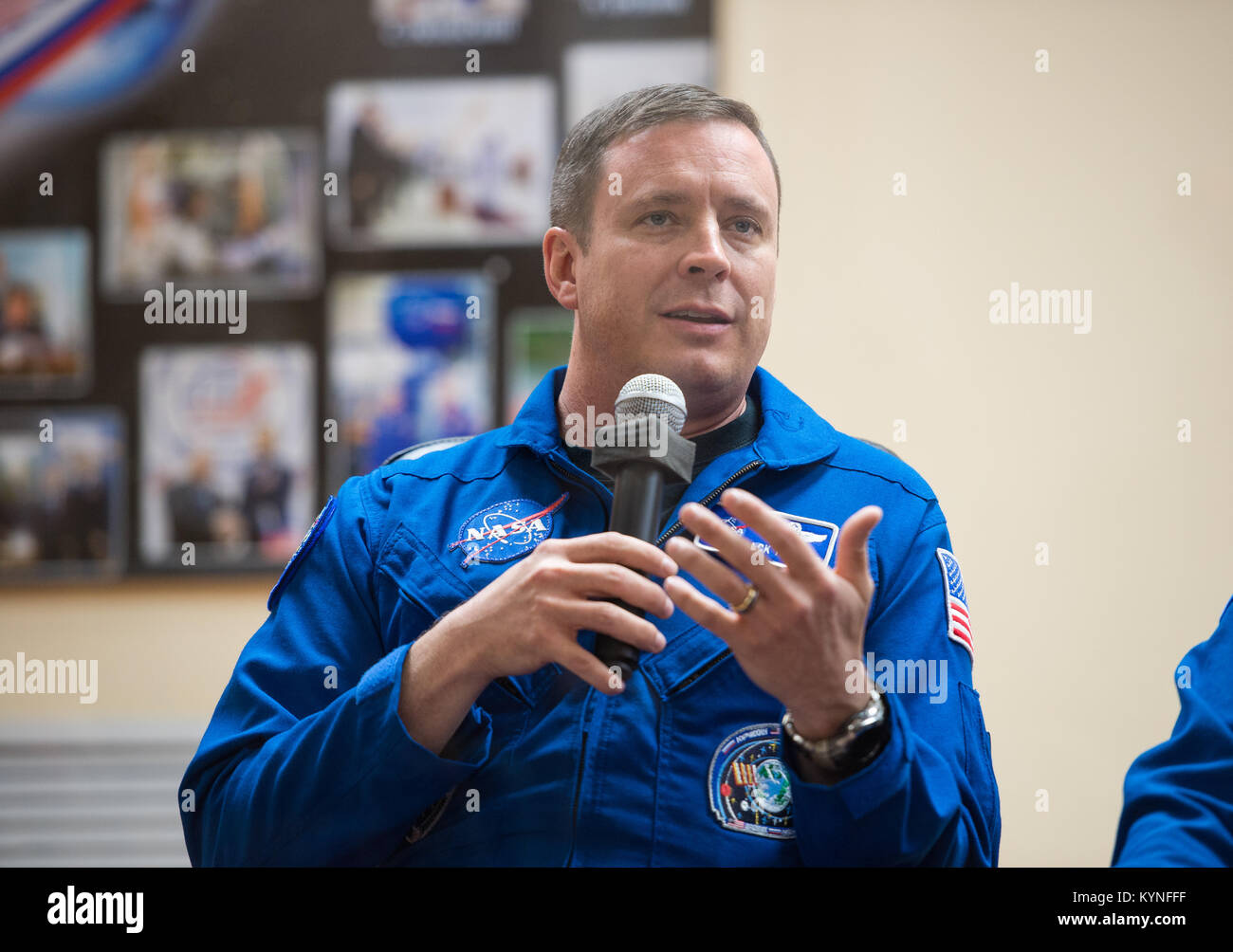 Expedition 51 Flight Engineer Jack Fischer of NASA, answers a question during a press conference on Wednesday, April 19, 2017, at the Cosmonaut Hotel in Baikonur, Kazakhstan. Launch of the Soyuz rocket is scheduled for April 20 and will carry Fischer and Soyuz Commander Fyodor Yurchikhin of Roscosmos into orbit to begin their four and a half month mission on the International Space Station. Photo Credit: (NASA/Aubrey Gemignani) Stock Photo