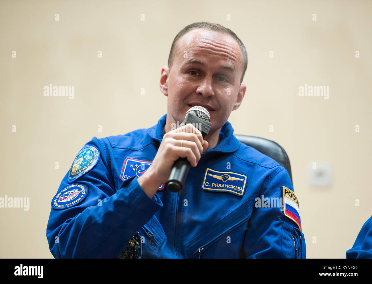 Expedition 51 backup crew member, Sergey Ryazanskiy of Roscosmos answers a question during a press conference on Wednesday, April 19, 2017 at the Cosmonaut Hotel in Baikonur, Kazakhstan. Launch of the Soyuz rocket is scheduled for April 20 and will carry Expedition 51 prime crew members Soyuz Commander Fyodor Yurchikhin of Roscosmos and Flight Engineer Jack Fischer of NASA, into orbit to begin their four and a half month mission on the International Space Station. Photo Credit: (NASA/Aubrey Gemignani) Stock Photo