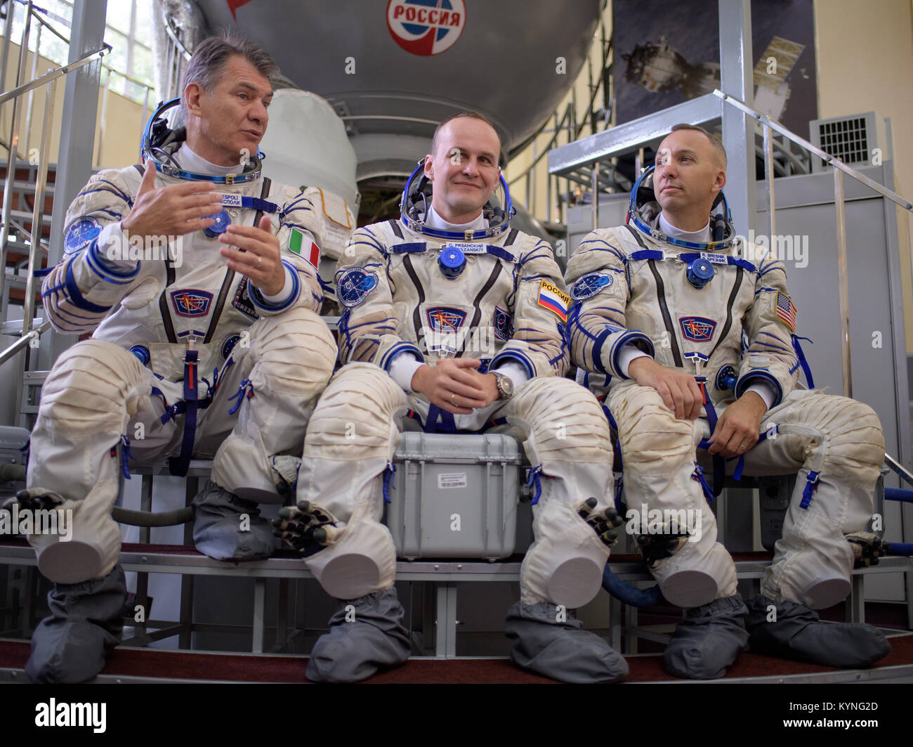 Expedition 52 flight engineers Paolo Nespoli of ESA, left, Sergey Ryazanskiy of Roscosmos, and Randy Bresnik of NASA answer questions from the press outside the Soyuz simulator ahead of their final Soyuz qualification exam, Friday, July 7, 2017 at the Gagarin Cosmonaut Training Center (GCTC) in Star City, Russia. Photo Credit: (NASA/Bill Ingalls) Stock Photo