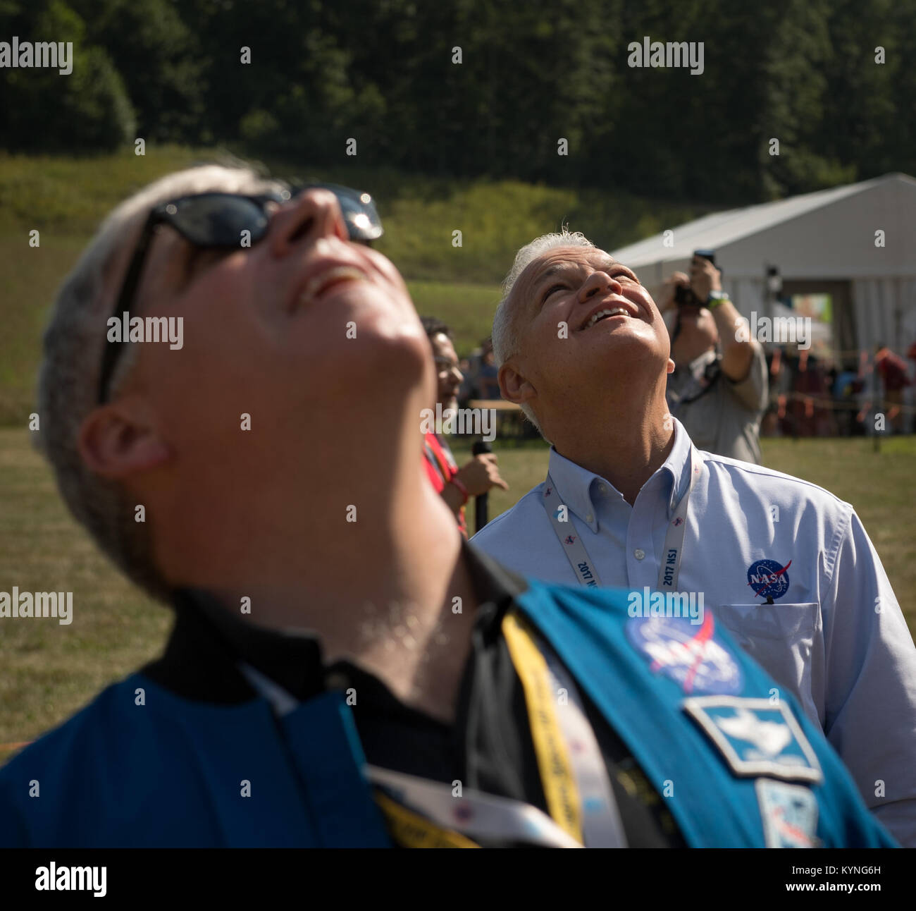 Greg “Box” Johnson, executive director of Center for the Advancement of Science in Space (CASIS) and former astronaut, foreground, and NASA Acting Chief Technologist Douglas Terrier watch as attendees of the Boy Scouts of America National Jamboree launch a weather balloon, Tuesday, July 25, 2017 at the Summit Bechtel Reserve in Glen Jean, West Virginia. Photo Credit: (NASA/Bill Ingalls) Stock Photo