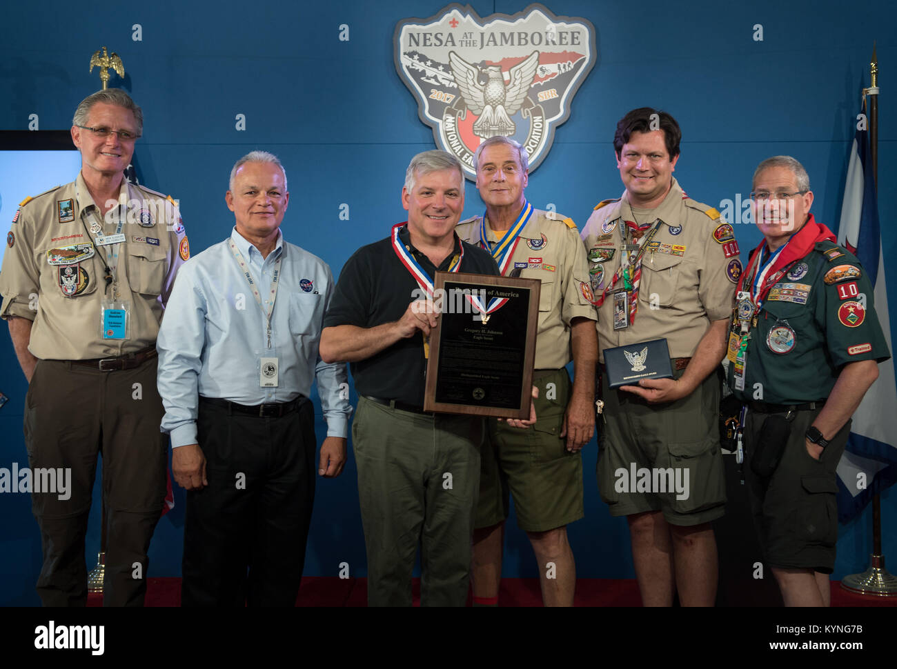 Greg “Box” Johnson, executive director of Center for the Advancement of Science in Space (CASIS) and former astronaut, third from left, receives an Distinguished Eagle Scout Award from Director of Strategic Initiatives, National Foundation, Boy Scouts of America Drew Glassford, left, NASA Acting Chief Technologist Douglas Terrier, Assistant Chief Scout Executive Don McChesney, National Eagle Scout (NESA) Committee member Todd Plotner, and Physician Brad Epstein, right, during the Boy Scouts of America National Jamboree, Tuesday, July 25, 2017 at the Summit Bechtel Reserve in Glen Jean, West Vi Stock Photo