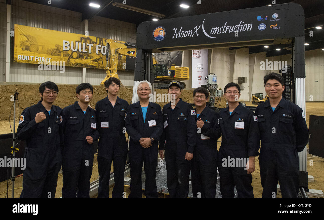 The MoonXConstruction team from Ansan, South Korea poses for a group picture, Friday, Aug. 25, 2017 at Caterpillar, Inc.'s Edwards Demonstration and Learning Center in Peoria, Ill. Team members are Chang Heum Byun, Chong Pyo Chung, Dong Uk Seol, Jaeho Lee, Jin Young Lee, Jun Seok Lee, Sang Joon Kang, Yoon Sun Lee, Byung Chul Chang, Hyu Soung Shin, and team lead Tai Sik Lee. NASA's 3D-Printed Habitat Challenge is advancing the additive construction technology needed to create sustainable housing for deep space exploration. Teams are competing in Phase 2: Level 3, for $500,000 in prize money. Te Stock Photo