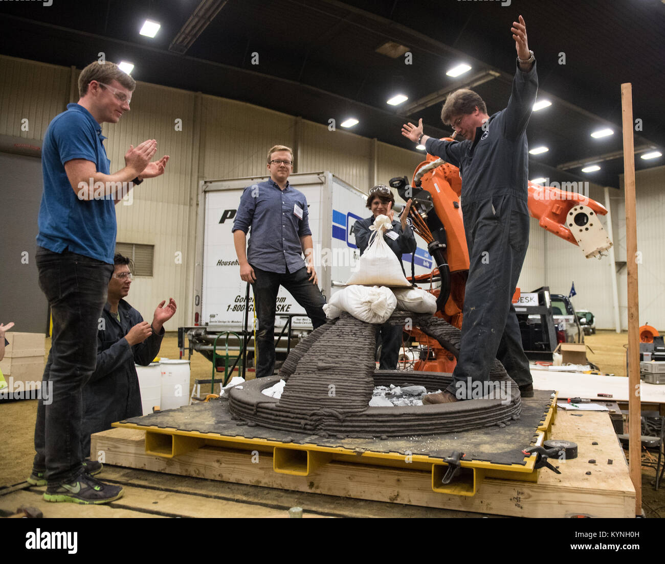 Members of the Penn State Den@Mars team of University Park, Pa., celebrate after their 3D-printed dome structure successfully held 50 kilograms in order to qualify for final testing, Saturday, Aug. 26, 2017 at Caterpillar, Inc.'s Edwards Demonstration and Learning Center in Peoria, Ill. NASA's 3D-Printed Habitat Challenge is advancing the additive construction technology needed to create sustainable housing for deep space exploration. Teams are competing in Phase 2: Level 3, for $500,000 in prize money. Teams have to 3D-print structural habitat pieces that will be crush-tested and evaluated, a Stock Photo