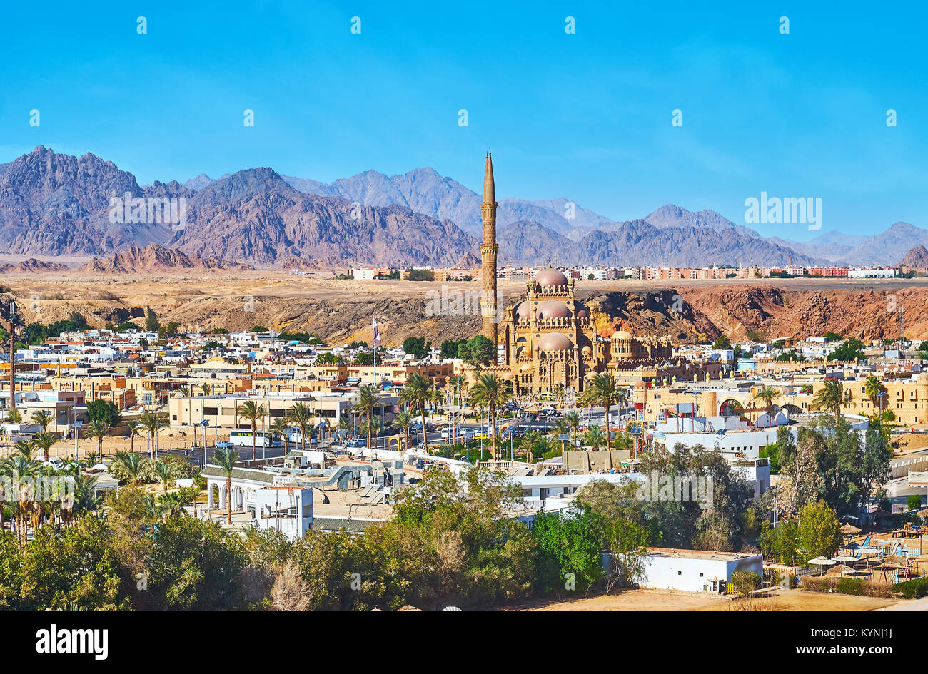Aerial view of Sharm Al Maya district with its main landmark - Al Sahaba Mosque, surrounded by tourist market buildings, cafes and hotels with giant r Stock Photo