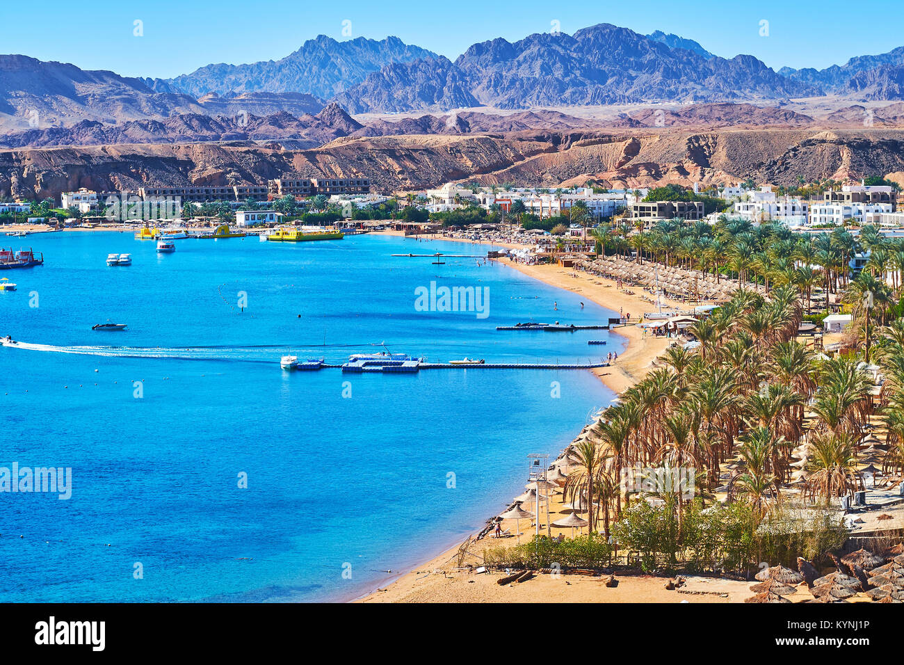 The comfortable sand beach line of El Maya bay, surrounded by giant rocky mountains, Sharm El Sheikh, Egypt. Stock Photo