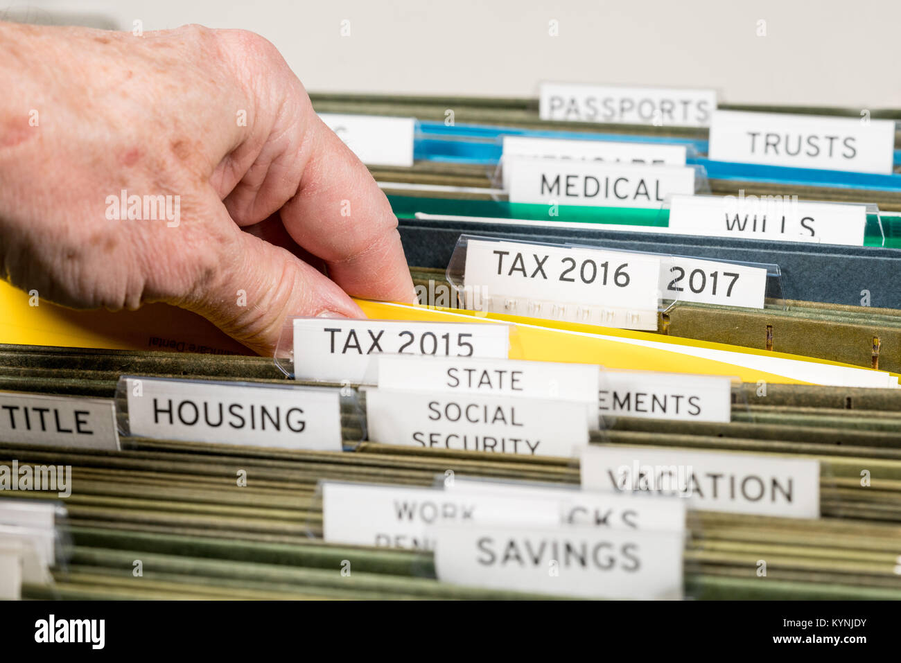 Home filing system for taxes organized in folders Stock Photo
