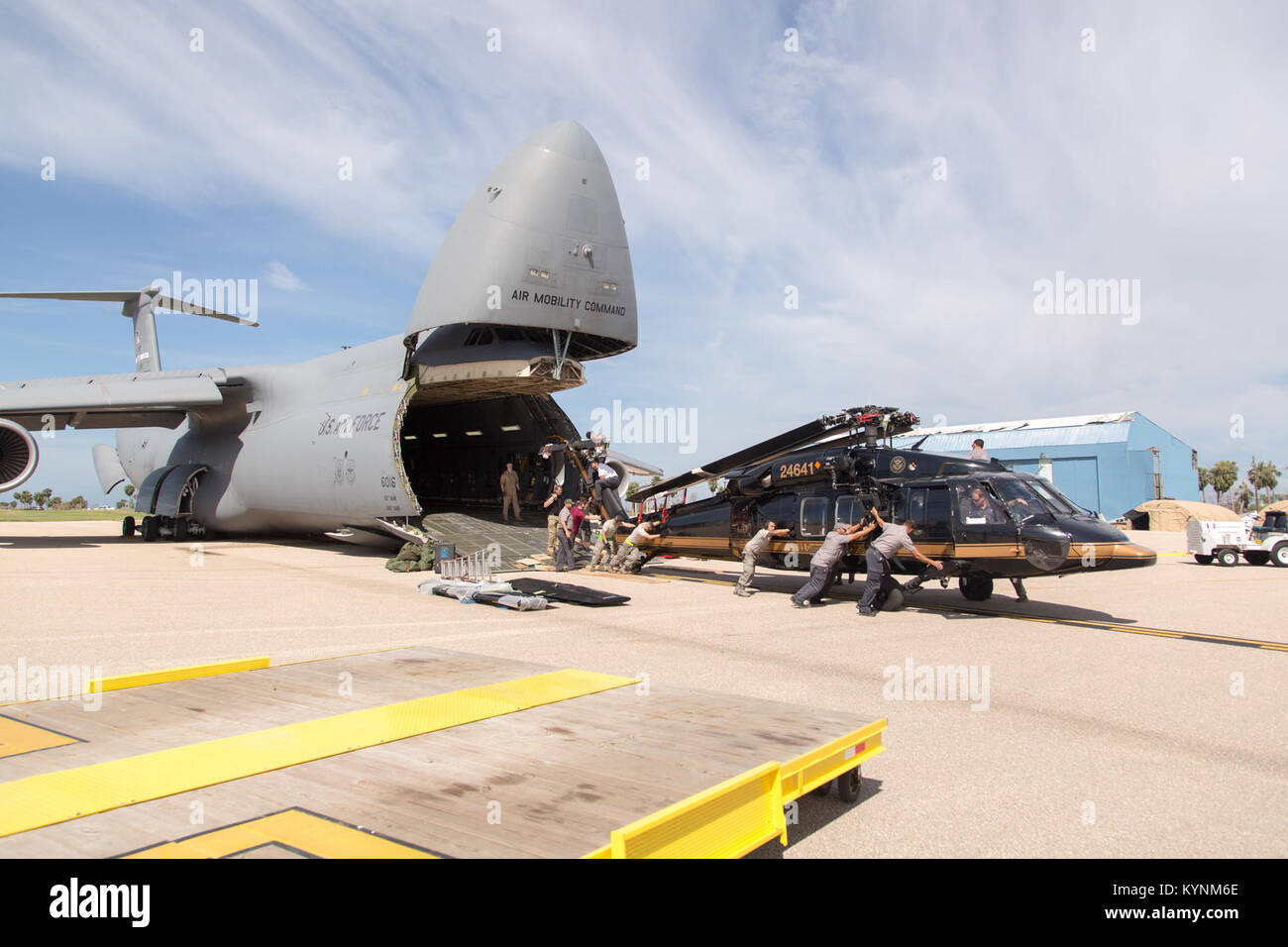 Caribbean-based PAE maintenance staff and U.S. Air Force (USAF) personnel offload CBP Air and Marine Operations UH-60 Black Hawks from a C-5 aircraft, in Aguadilla, Puerto Rico.  October 2, 2017.   Photos by Mani Albrecht Stock Photo