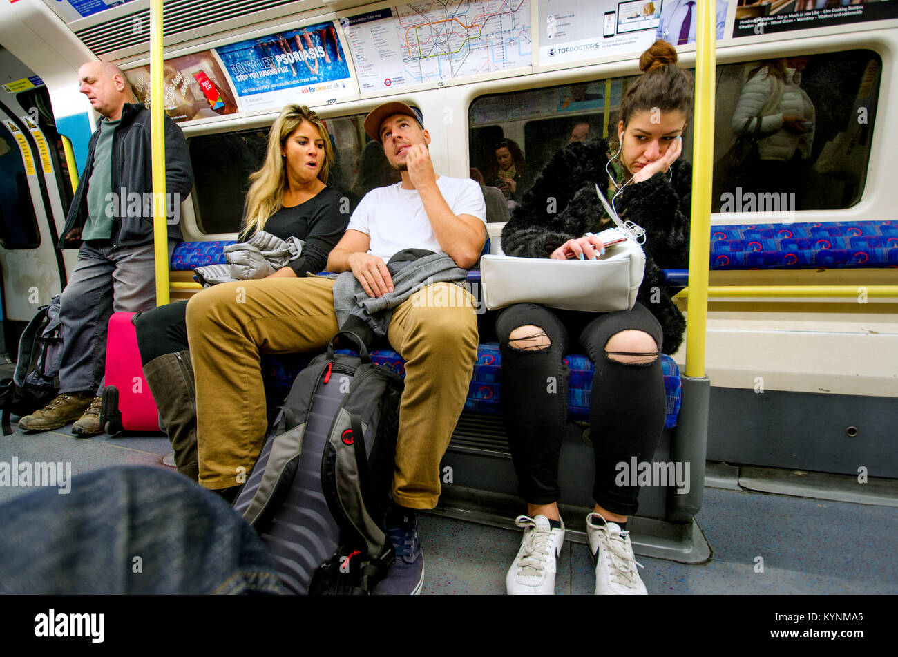 London, England, UK. People sitting in a tube train Stock Photo