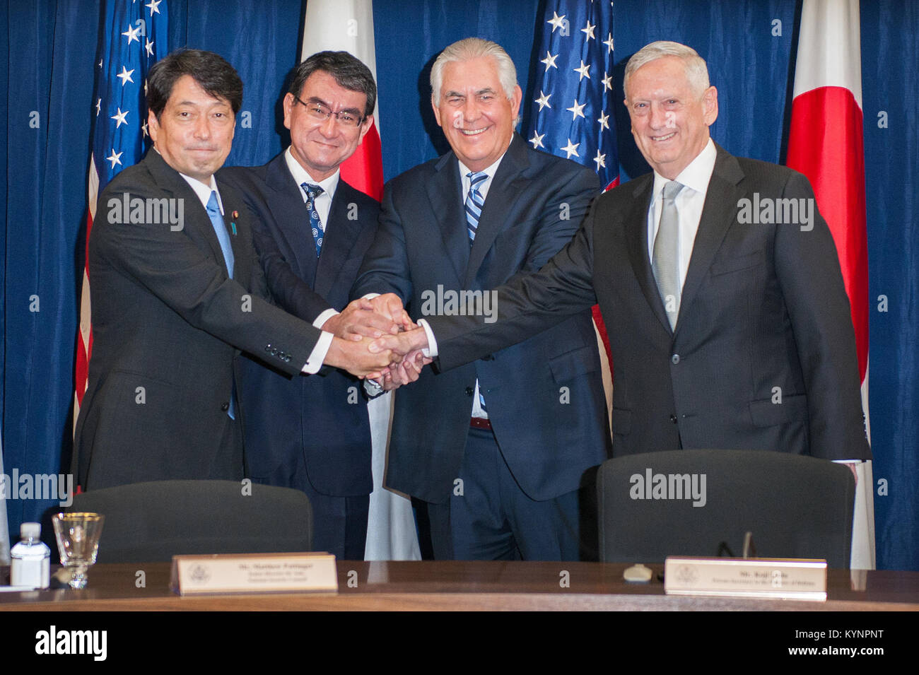 Secretary of State Rex Tillerson, U.S. Secretary of Defense Jim Mattis, Japanese Foreign Minister Taro Kono, and Japanese Defense Minister Itsunori Onodera shake hands at the opening of the U.S.-Japan Security Consultative Committee (“2+2”), at the U.S. Department of State in Washington, D.C., on August 17, 2017. [State Department Photo/ ] Secretaries Tillerson and Mattis Shake Hands With Their Japanese Counterparts, 36461782312 o Stock Photo