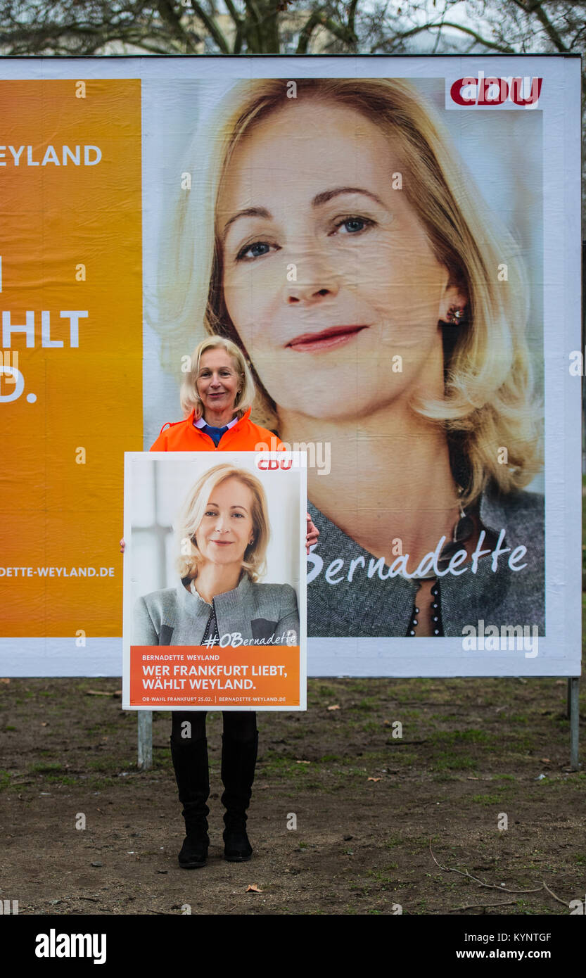 Frankfurt am Main, Germany. 15th Jan, 2018. The CDU (Christian Democratic Union) mayor candidate Bernadette Weyland poses in front of a new election poster in Frankfurt am Main, Germany, 15 January 2018. Weyland is introducing her new poster motif, which will be plastered all over the city. The mayor elections of Germany's finance capital will take place on the 25th of February 2018. Credit: Andreas Arnold/dpa/Alamy Live News Stock Photo