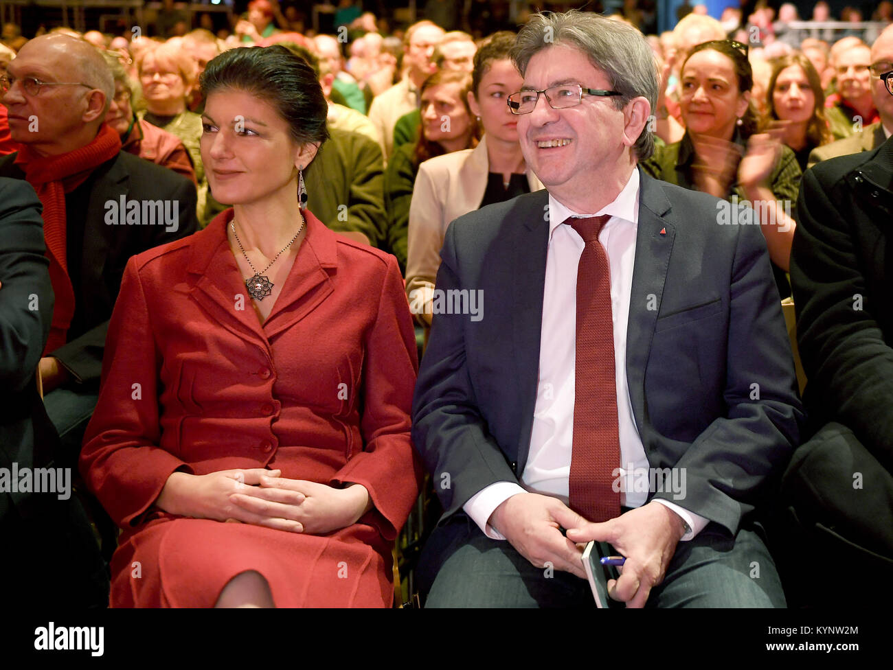 Berlin, Germany. 14th Jan, 2018. The faction leader of the party 'die Linke', Sahra Wagenknecht sits next to French leftist politician Jean-Luc Melenchon (R) at the annual kick-off event 'Aufbruch für soziale Sicherheit' (lit. 'Takeoff for social security') at the Kosmos facility in Berlin, Germany, 14 January 2018. Credit: Britta Pedersen/dpa/Alamy Live News Stock Photo
