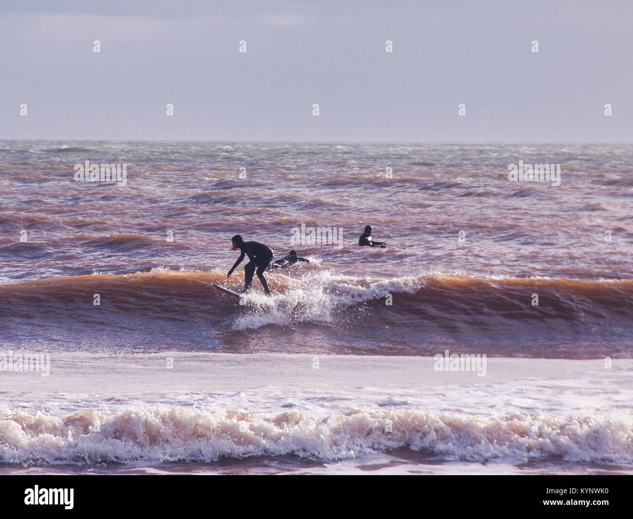 Sidmouth, 15th Jan 18 Strong winds produced good conditions for surfing at sea kayaking at Sidmouth, Devon. The sea turns red at Sidmouth in stormy conditions, as the local red sandstone mixes with the force of the sea. Credit: Photo Central/Alamy Live News Stock Photo