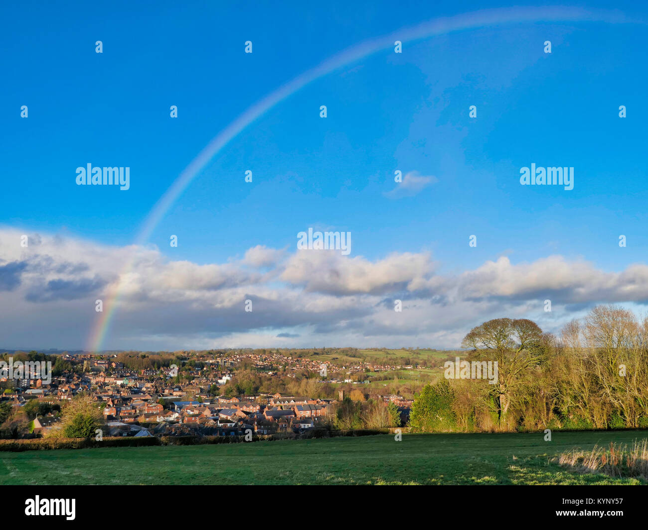 UK Weather: Snowbow rainbow over Ashbourne, Derbyshire as storms clouds approach over the gateway for the Peak District National Park Credit: Doug Blane/Alamy Live News Stock Photo