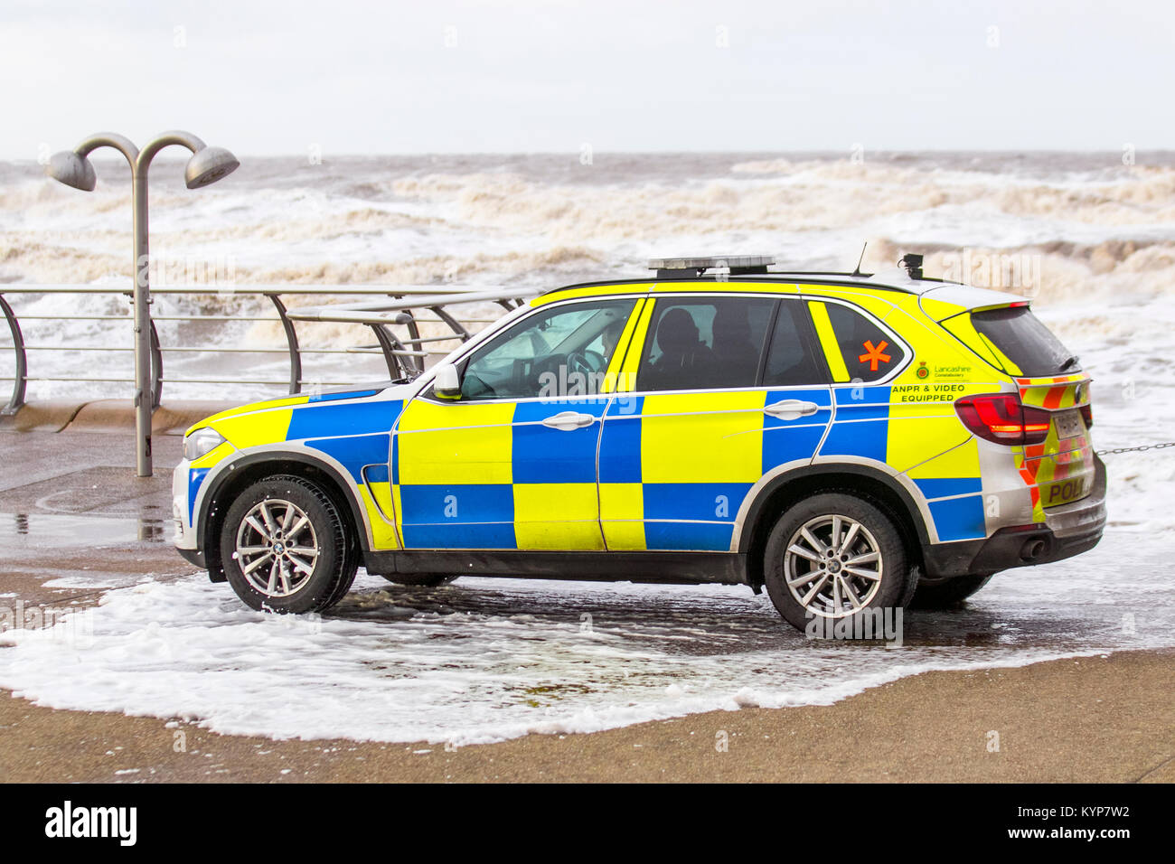 Blackpool Lancashire. 16th Jan 2018. UK Weather. Gale Force Winds in Blackpool. An amber 'be prepared' warning, which includes winds gusting up to 50mph in some areas, has been issued for the northwest coasts of England. Armed response vehicle (ARV) is a type of BMW police car operated by British law enforcement, policing vehicle, armed, protection, weapon, man, people, security, gun, car, street, force, officers.  ARVs Police cars are crewed by Authorised Firearms Officers to respond to incidents believed to involve firearms or other high-risk situations. Stock Photo