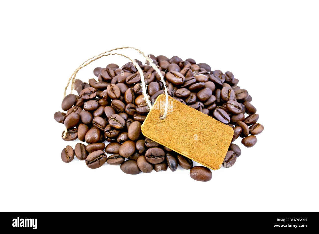Grains of black coffee with a tag and green leaves on a isolated white background Stock Photo