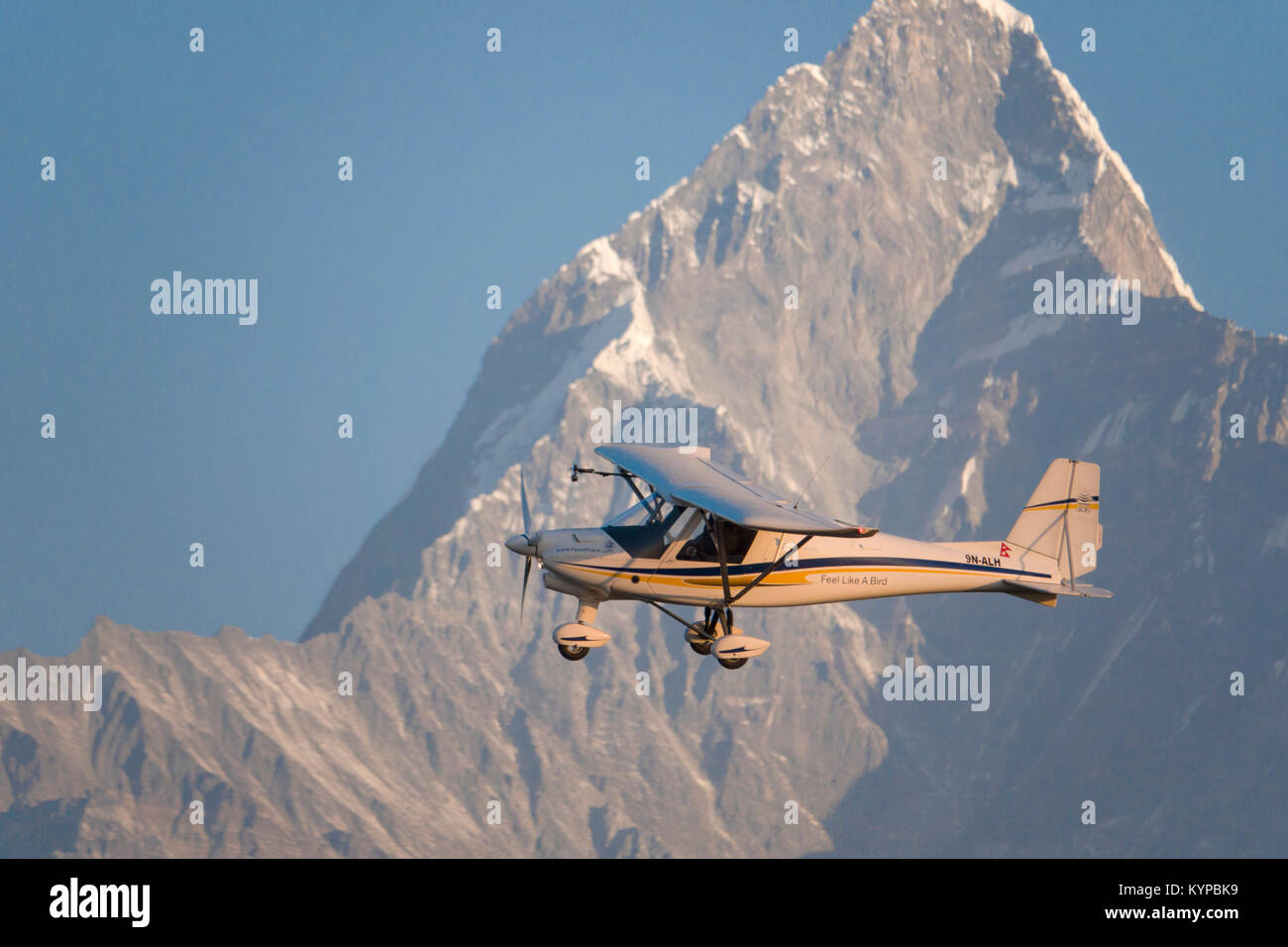 Tourist plane on sightseeing flight over the Annapurna mountains in Nepal Stock Photo