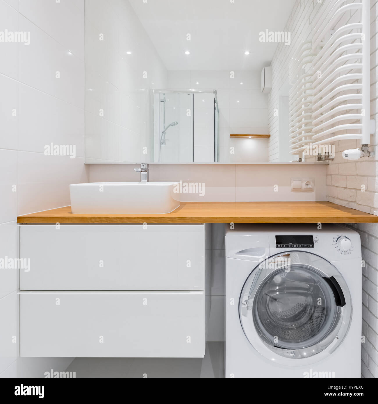 White Bathroom With Countertop Basin Big Mirror And Washer Stock