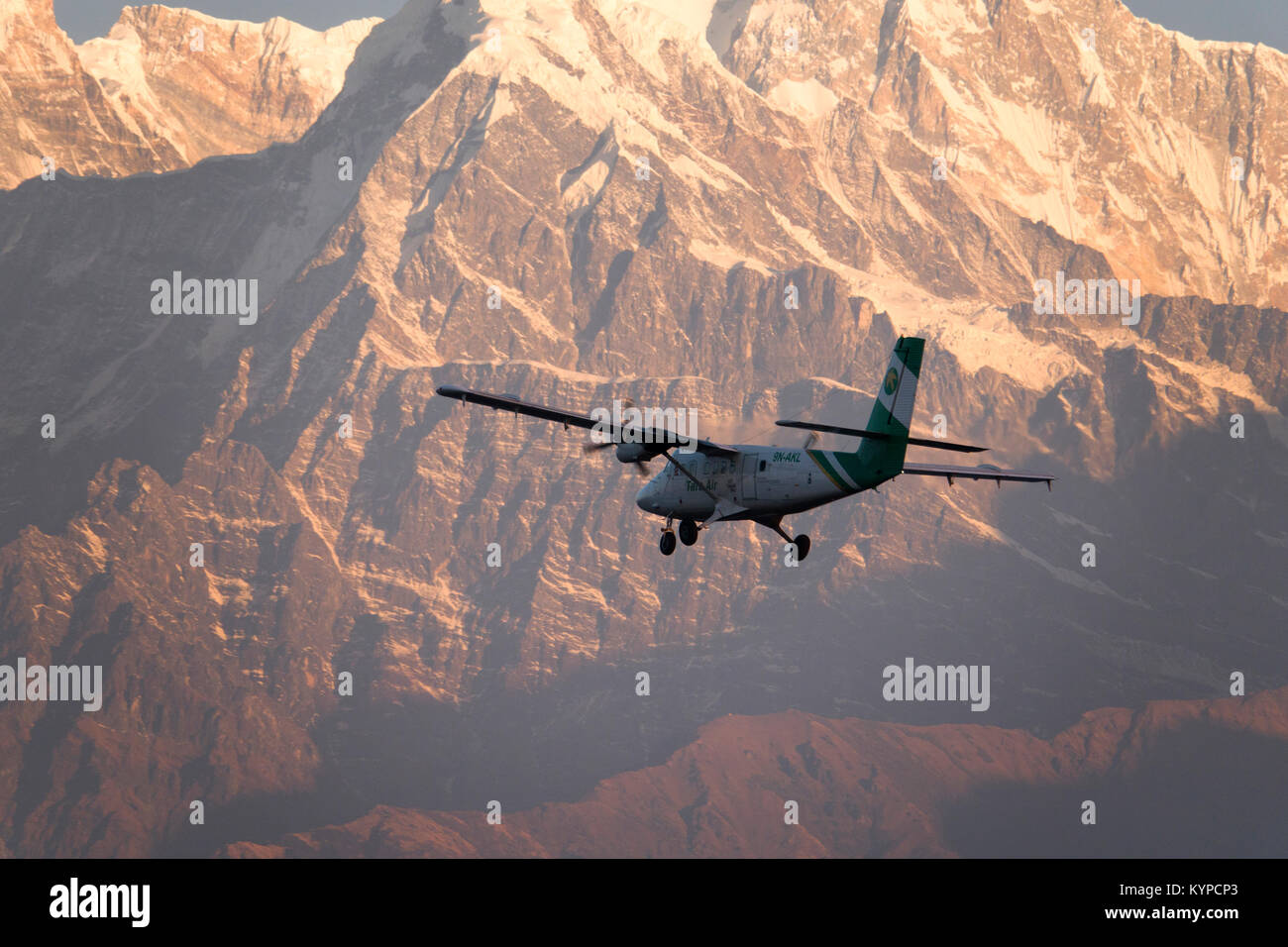 Tourist plane on sightseeing flight over the Annapurna mountains in Nepal Stock Photo
