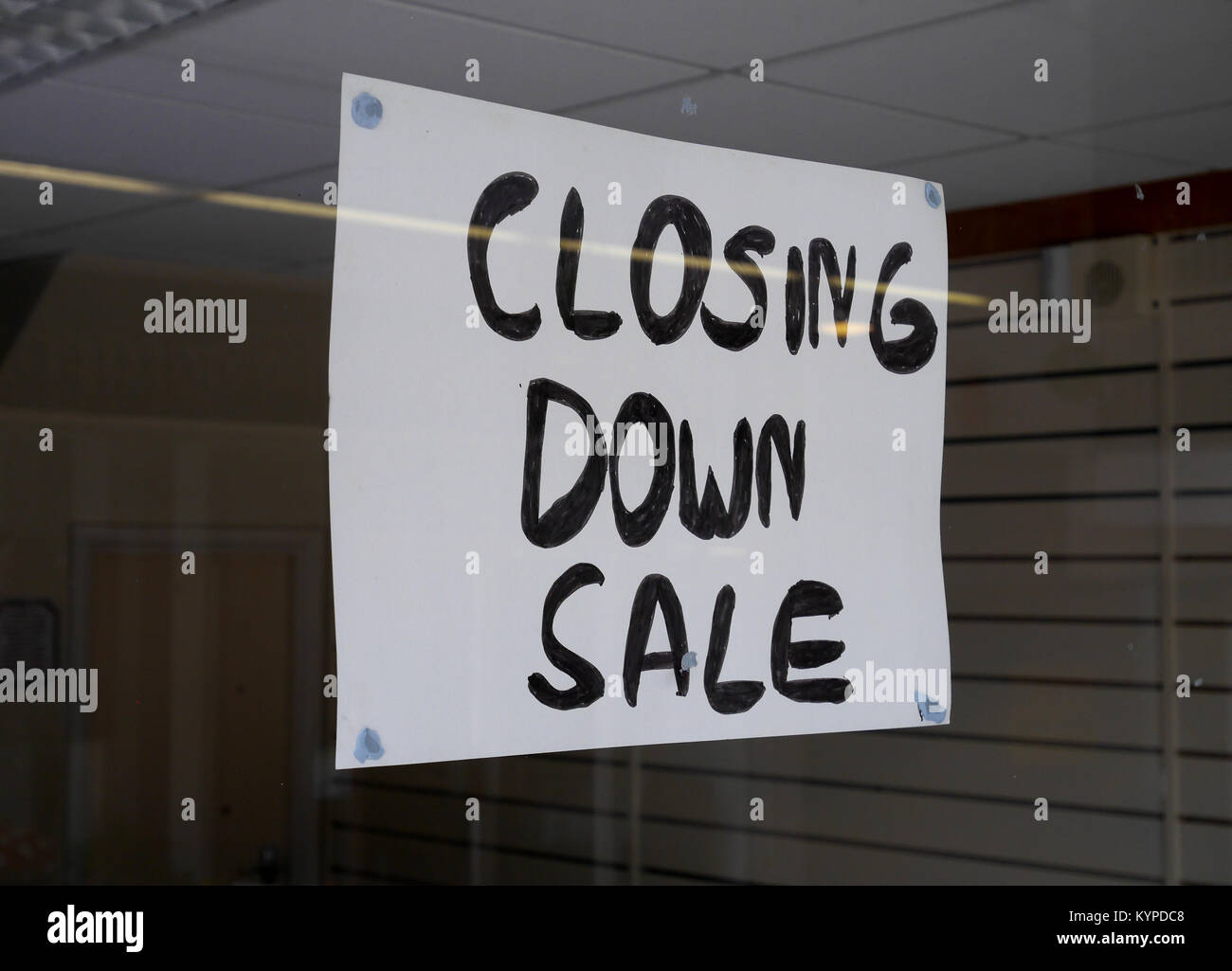 “Closing Down Sale”, Sign in Window of closed down retail business in deserted shopping precinct, Crossways Shopping Centre, Paignton,   Devon, UK Stock Photo
