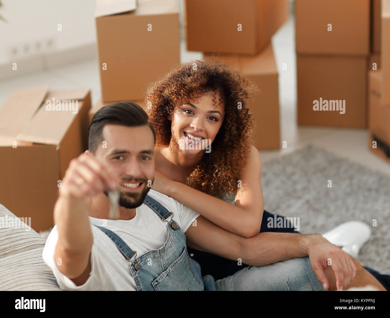 Young couple with a key to a new apartment Stock Photo - Alamy