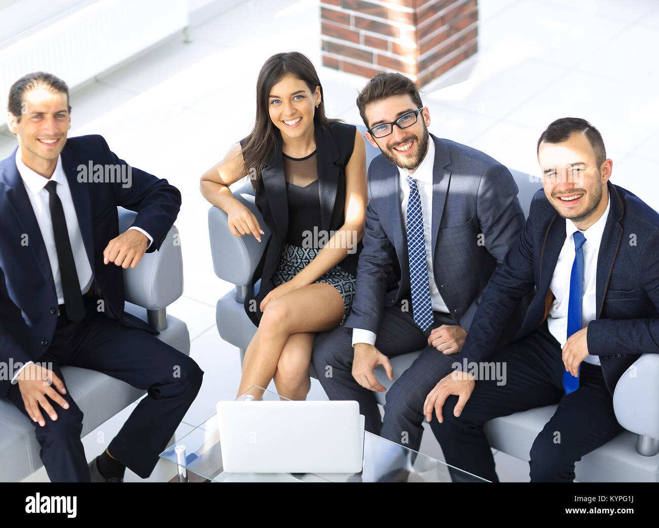 portrait of successful business team sitting in office lobby Stock ...