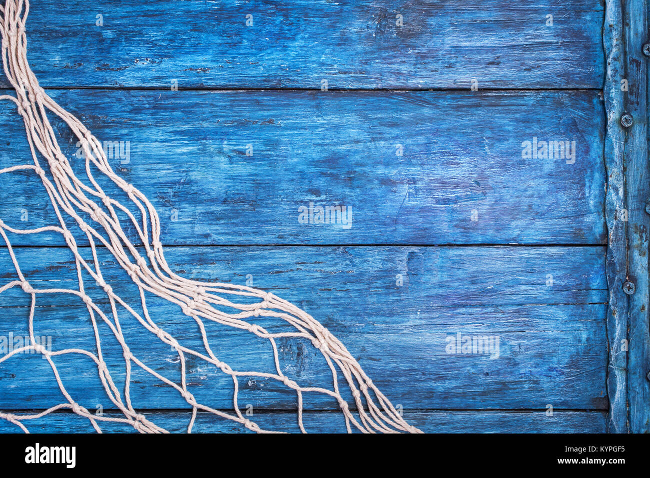 Premium Photo  Blue fishing net on white wooden wall