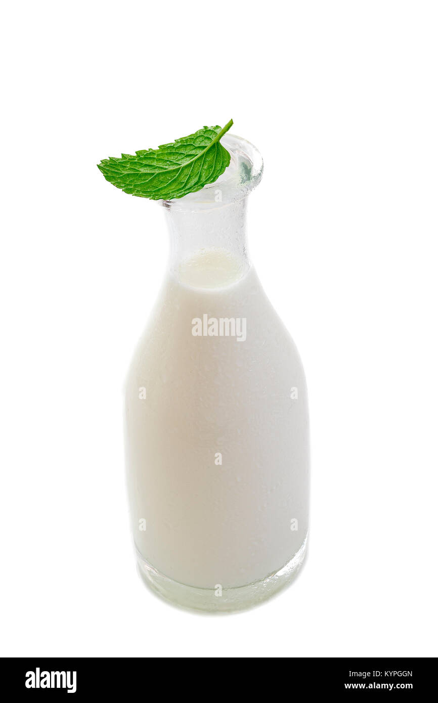 Front View of Open Bottle of Milk Isolated on White Backgroundwith a fresh mint leaf on the top Stock Photo