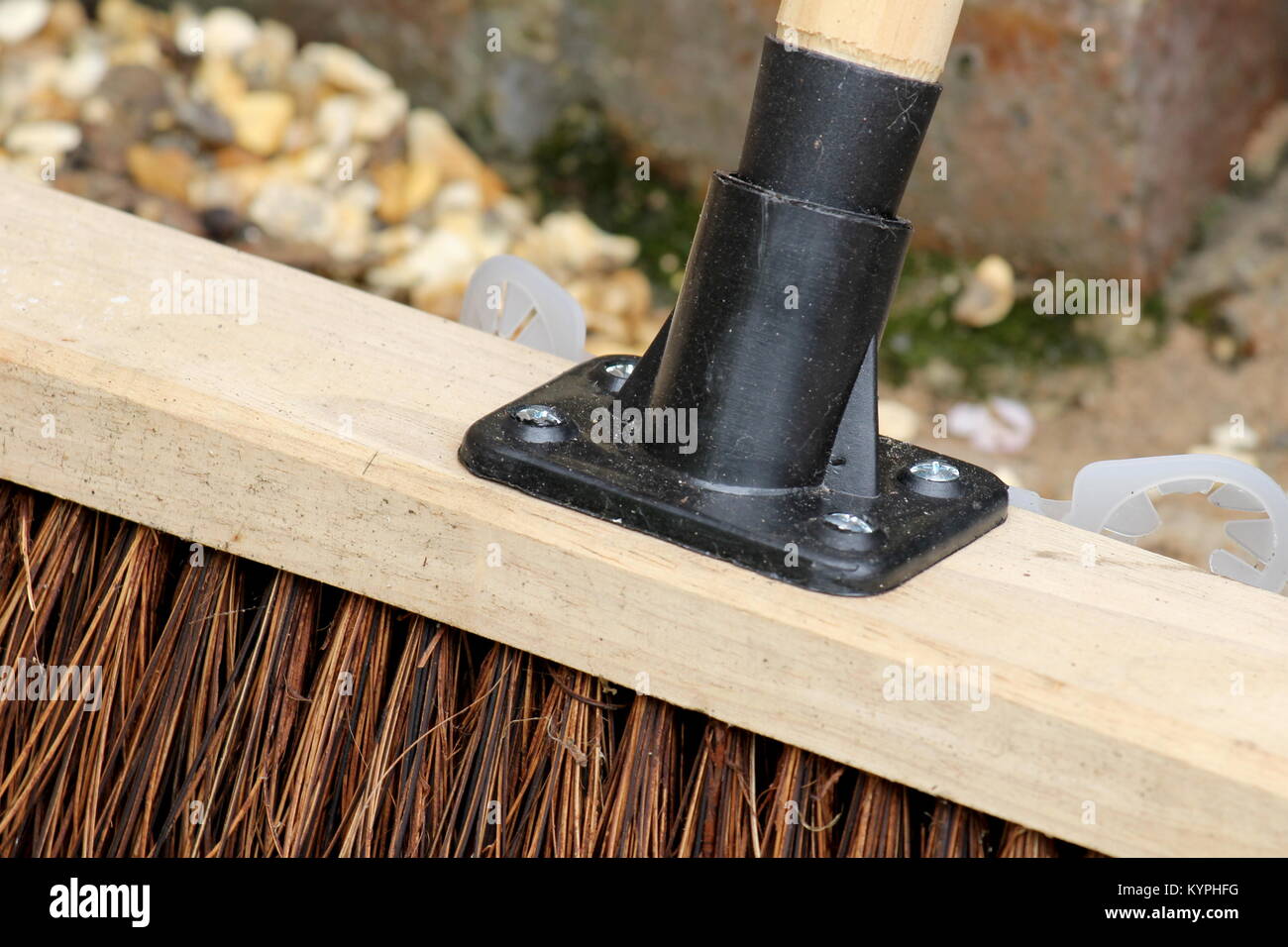 Close up of a garden broom or yard brush where the handle meets the head Stock Photo