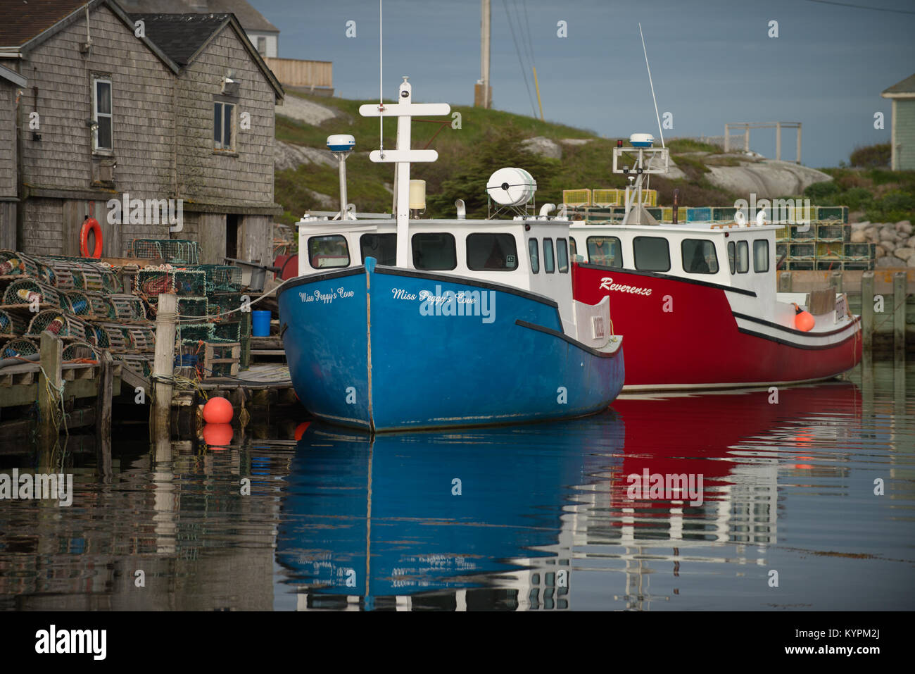 Colorful fishing boats moored in Peggy's Cove, Nova Scotia, Canada - Stock Image