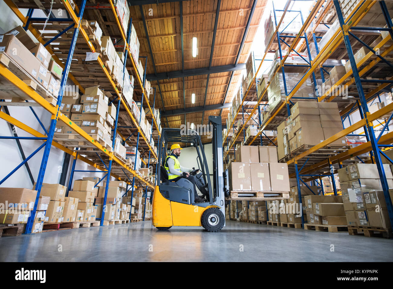 Warehouse man worker with forklift Stock Photo Alamy