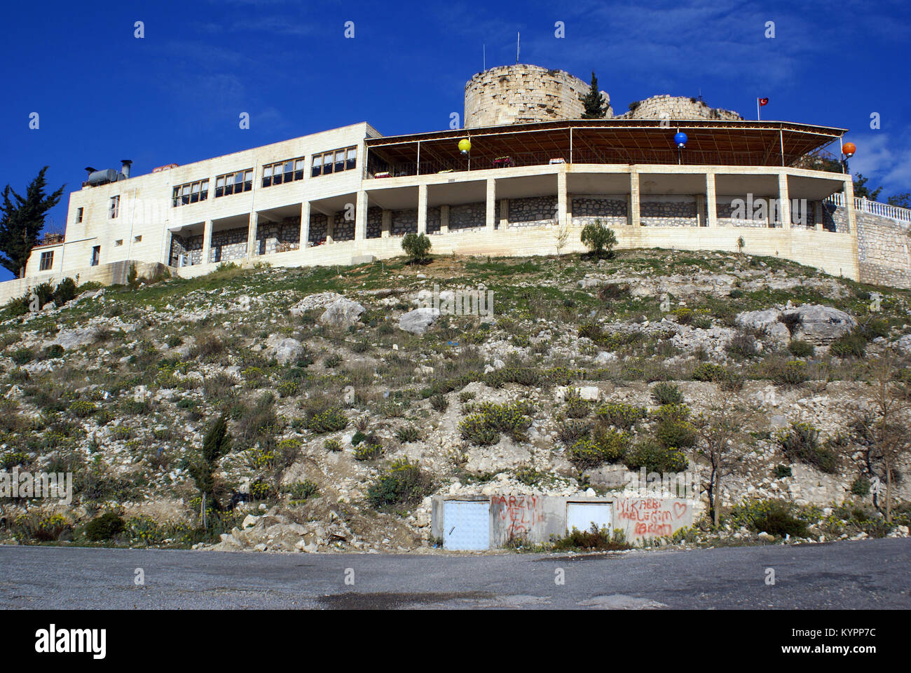 Restaurant and castle on the hill in Silifke, Turkey Stock Photo