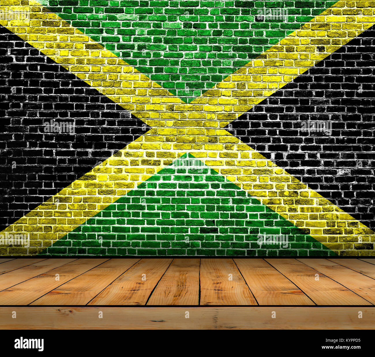 Jamaica flag painted on brick wall with wooden floor Stock Photo