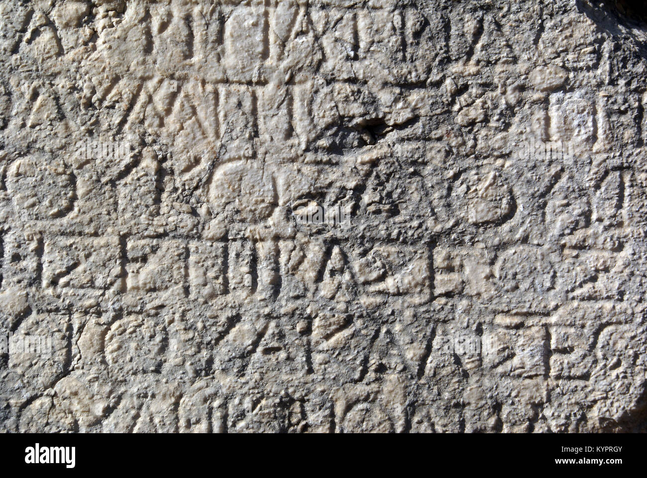 Greek letters on the marblewall in Phaselis, Turkey Stock Photo