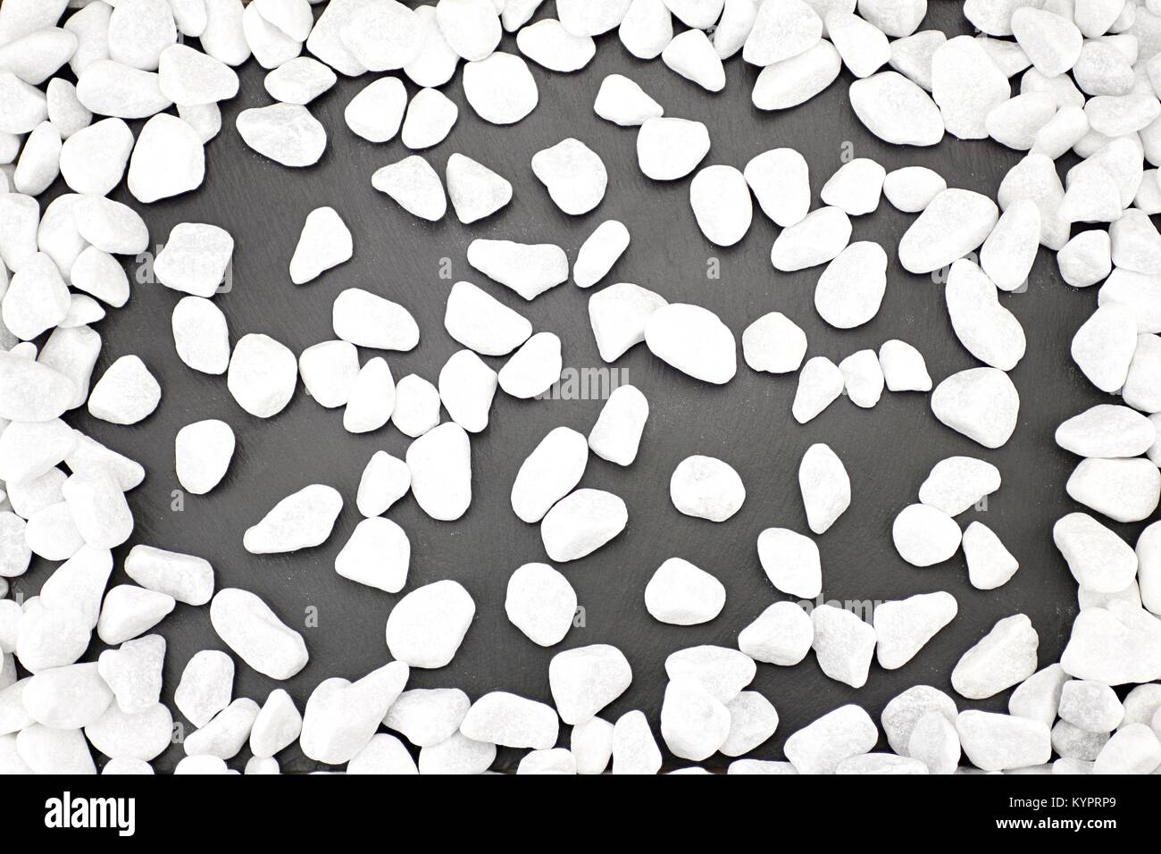 Black background with white pebbles Stock Photo