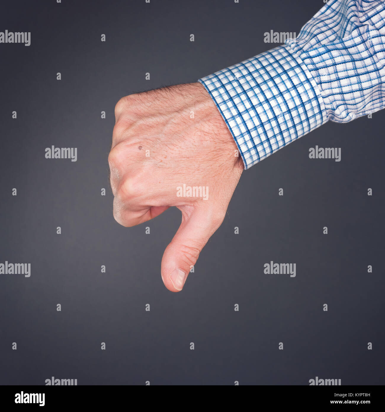 Dislike and disapprove hand gesture with thumb down, businessman is rejecting project Stock Photo