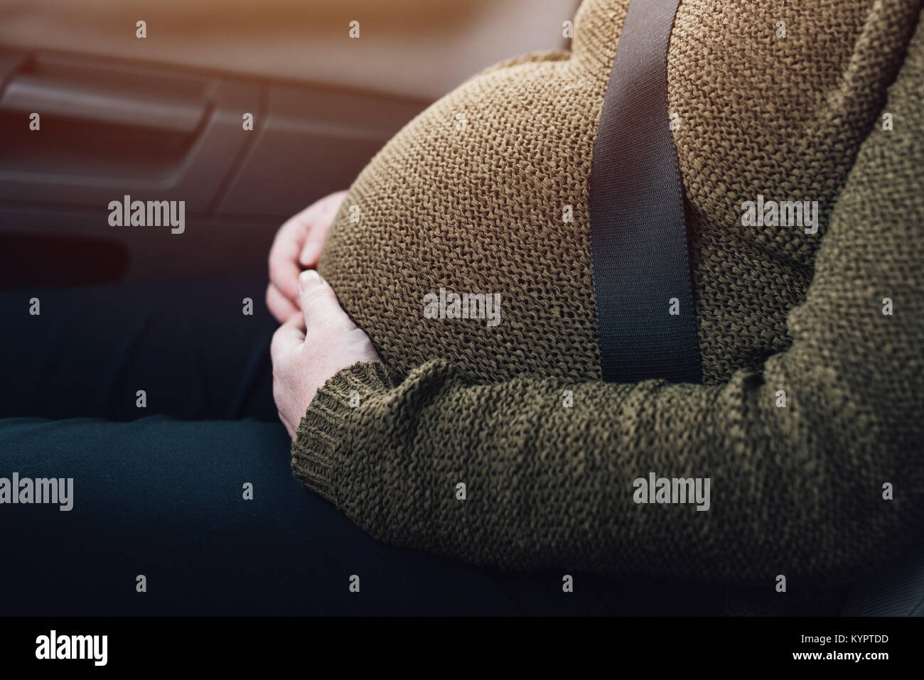 Pregnant woman with safety seat belt in the car Stock Photo Alamy