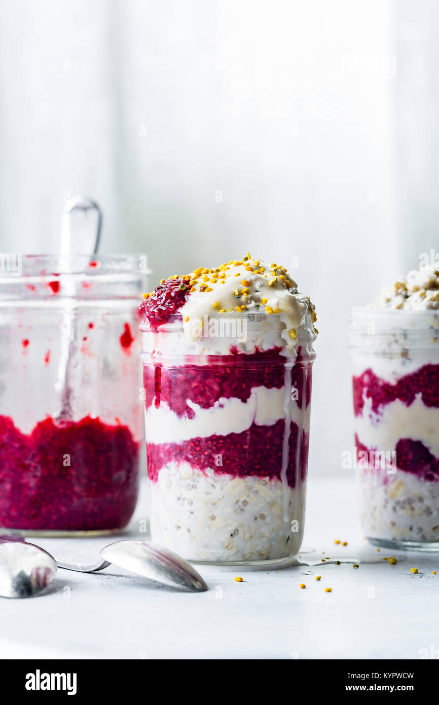 creamy vegan overnight oats with berry chia jam and bee pollen Stock