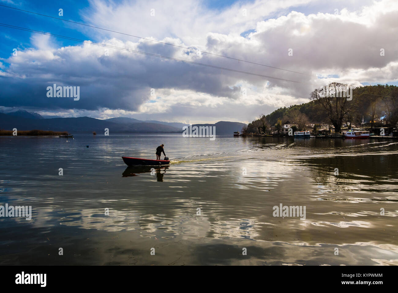 A fisherman in the Pamvotis lake of Ioannina in Greece Stock Photo
