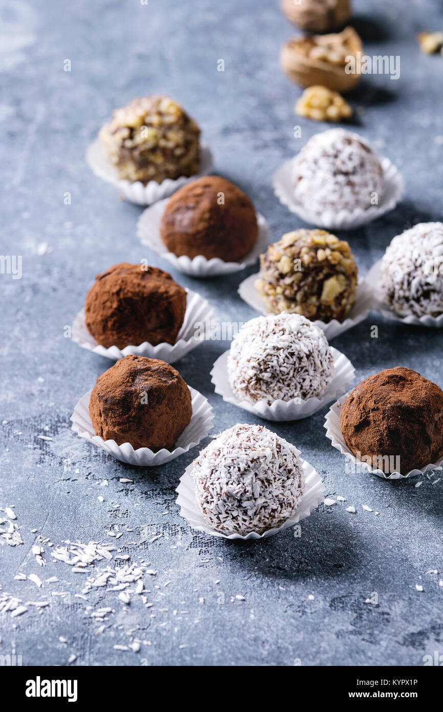 Variety of homemade dark chocolate truffles with cocoa powder, coconut