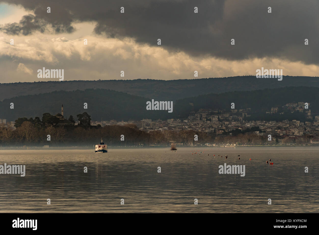 View of Ioannina city and the castles' s minaret from the pamvotida lake in Ioannina Greece Stock Photo