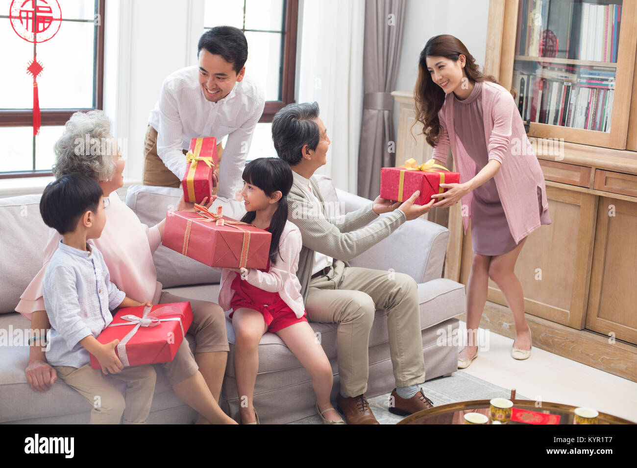 Family visiting with gifts during Chinese New Year Stock Photo Alamy
