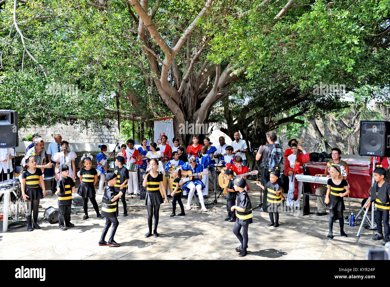 HAVANA, CUBA, MAY 5, 2009. Children dressed as bumblebees dancing in the Fit Cuba 2009 tourism festival in Havana, Cuba, on May 5th, 2009. Stock Photo