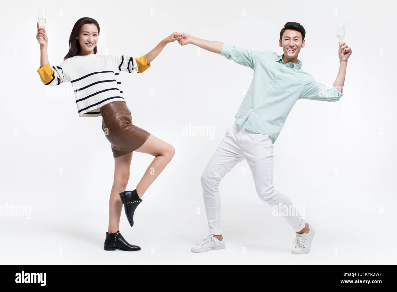 Cheerful young couple drinking champagne Stock Photo